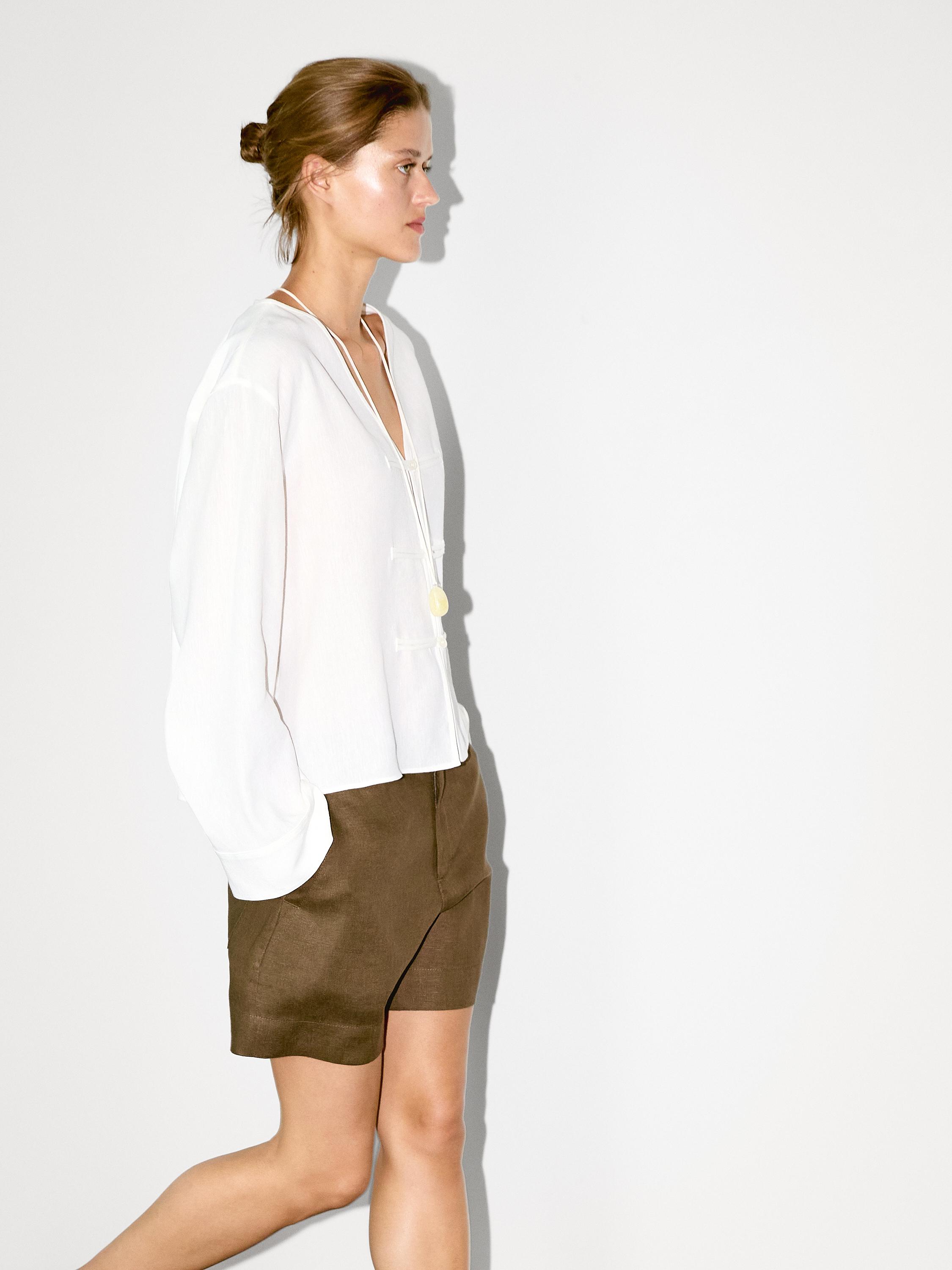 Flowing linen blend blouse with V-neckline